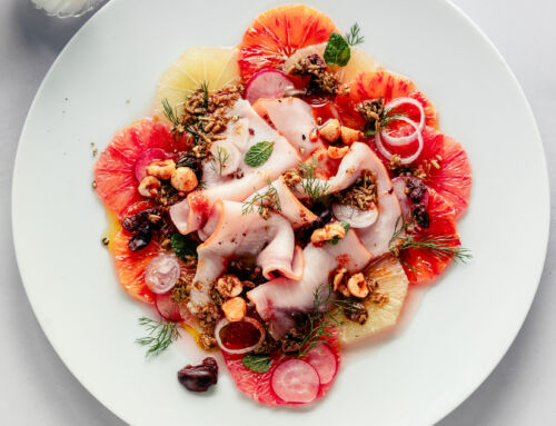 Carpaccio di pesce spada e agrumi con nocciole piccanti al miele